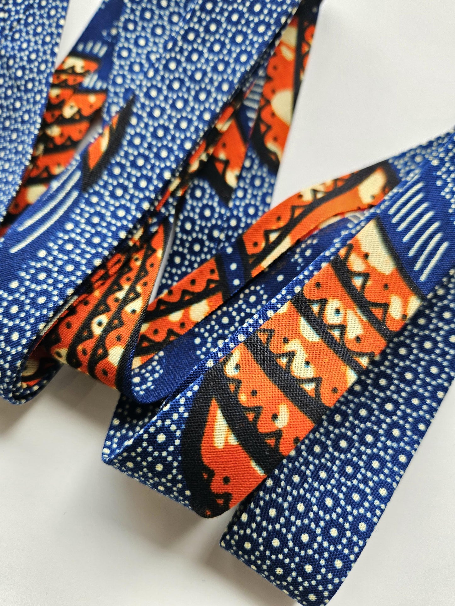 Navy Blue & Orange African Wax Fabric Bias Binding. 2.5cm Wide | Colourful Print Patterned Tape For Crafting / Quilting.