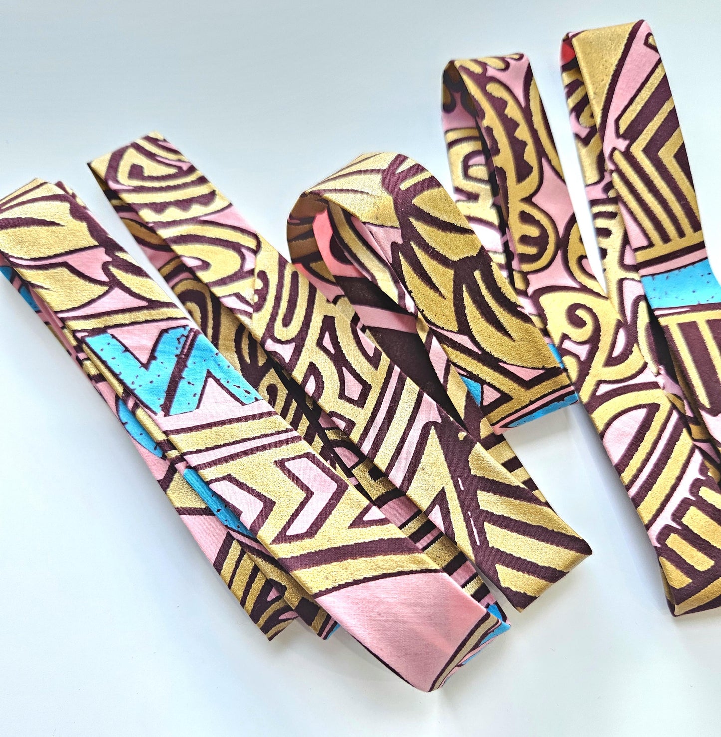 Set Of 3 African Wax Geometric Metallic Fabric Bias Binding. 5 Metres Each x  2.5cm Wide in Pink, Orange & Blue For Crafting And Quilting.