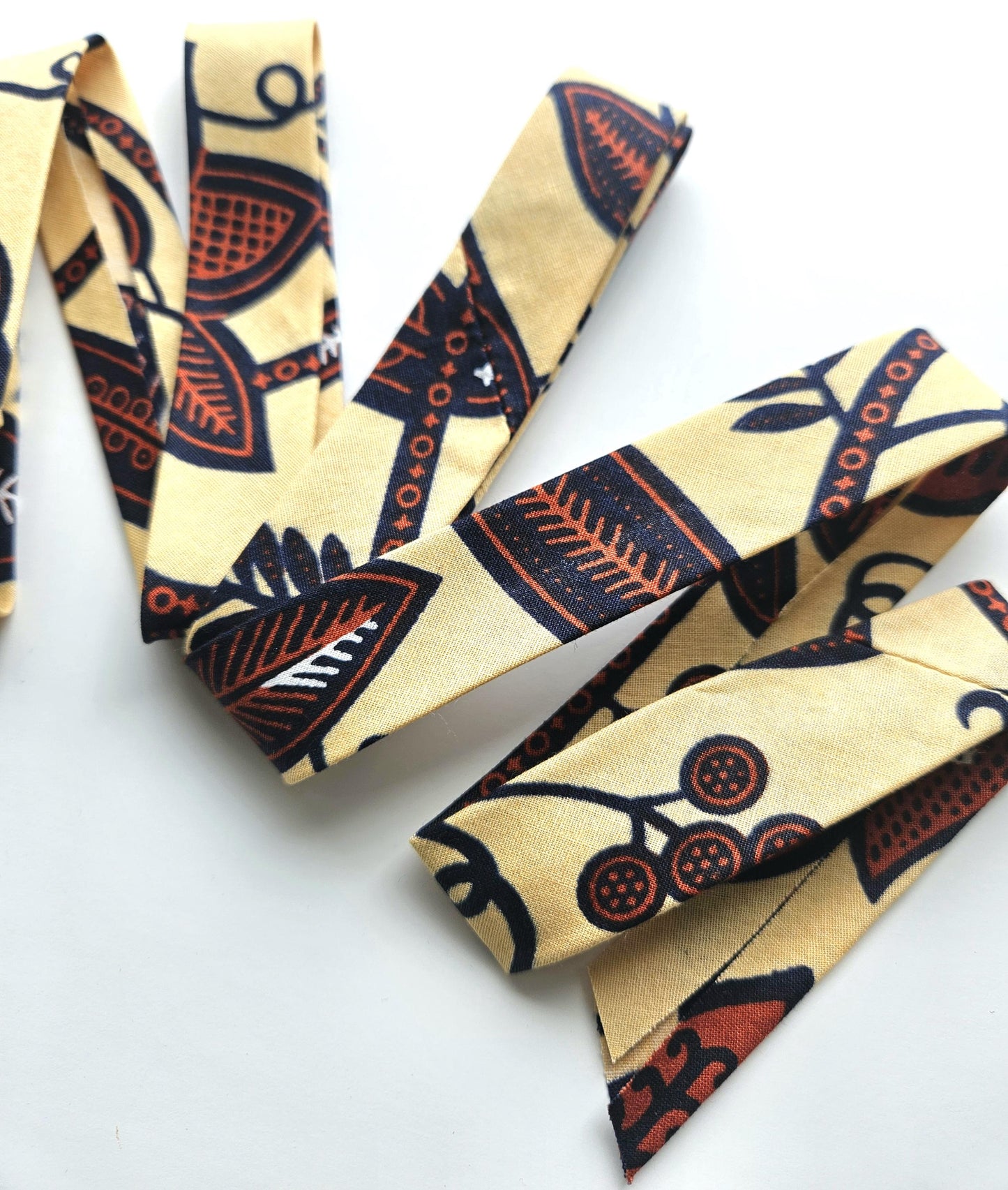 Set Of 3 African Wax Floral Themed Fabric Bias Binding. 5 Metres Each x  2.5cm Wide in Red, Beige, Blue and Brown For Crafting And Quilting.