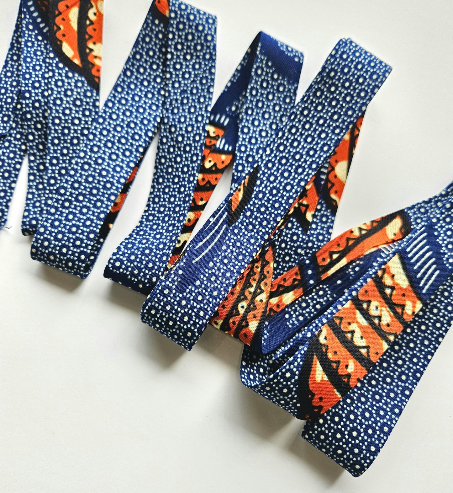 Navy Blue & Orange African Wax Fabric Bias Binding. 2.5cm Wide | Colourful Print Patterned Tape For Crafting / Quilting.
